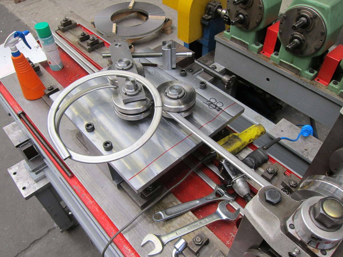 Tube bending after roll forming